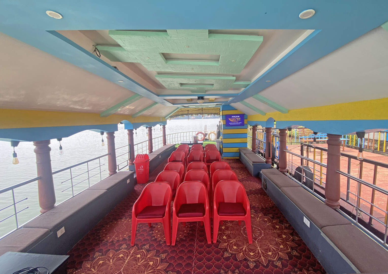 Comfortable seating area inside Akalappuzha houseboat