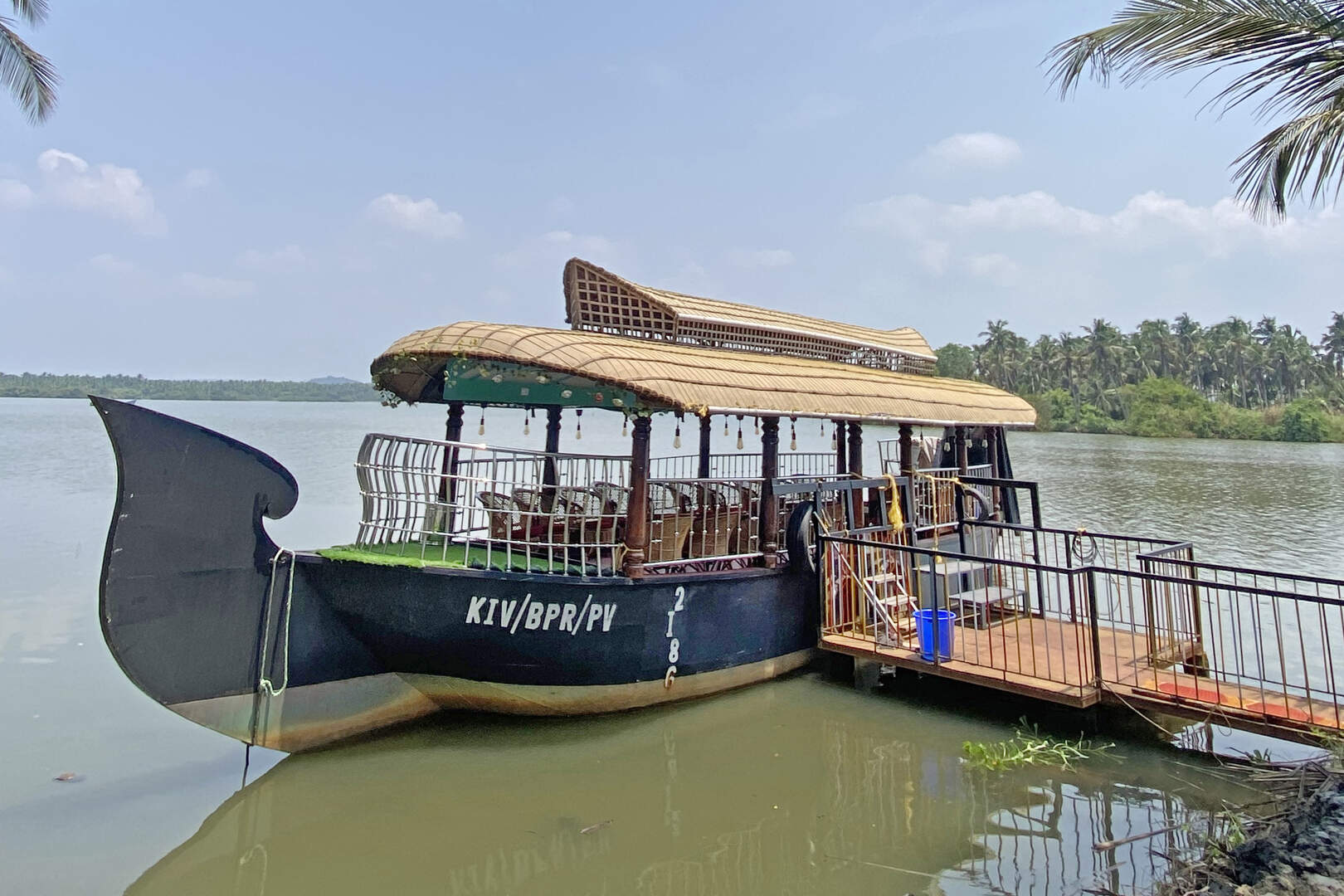 Wide view of small boat docked at Akalappuzha boating spot
