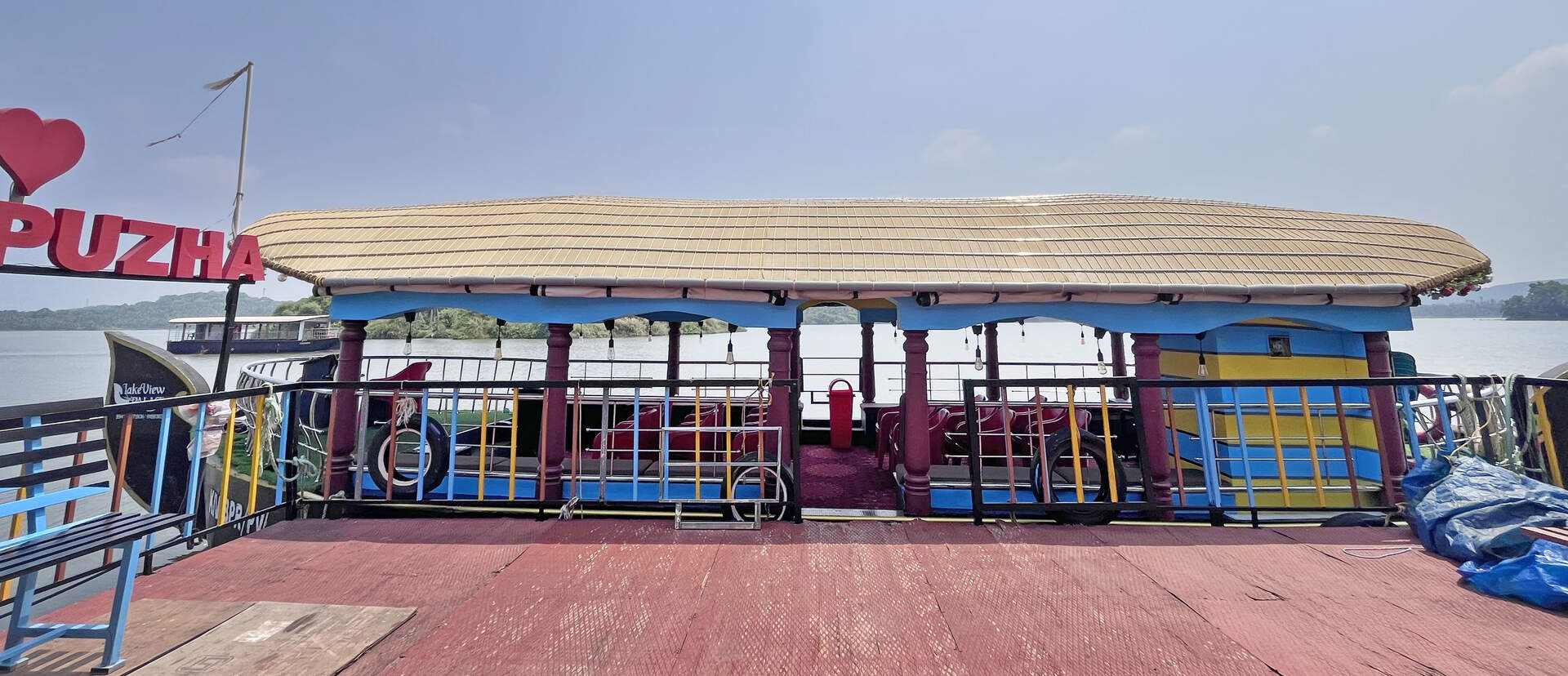Scenic wide-angle shot of boat in Akalappuzha lake