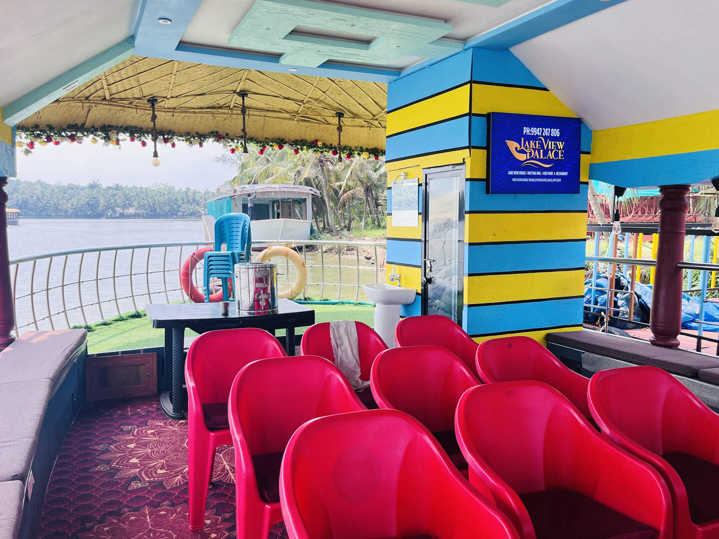 Cushioned seating inside Lake View Palace houseboat, Akalappuzha