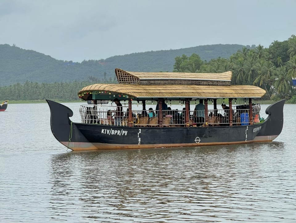 Family enjoying Akalappuzha cruise on a 20-seater boat from Lake View Palace