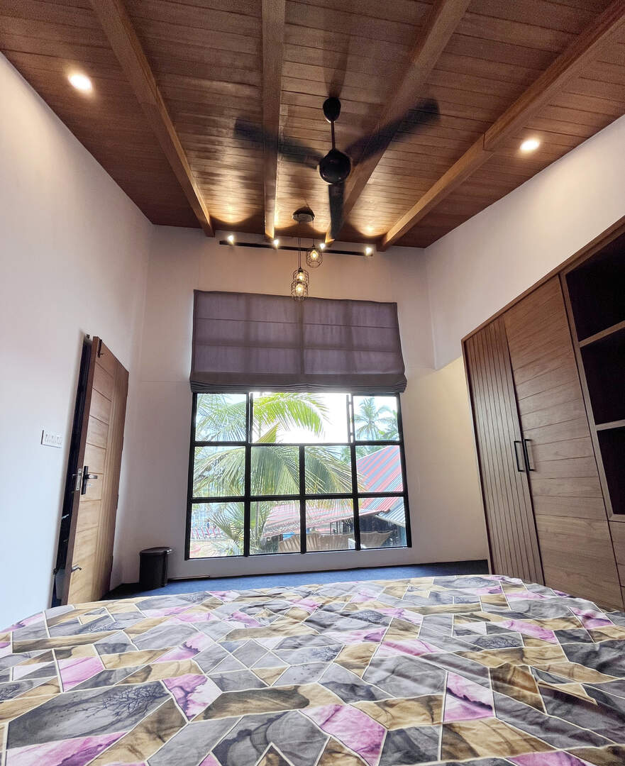 Homestay bedroom with window and outside view